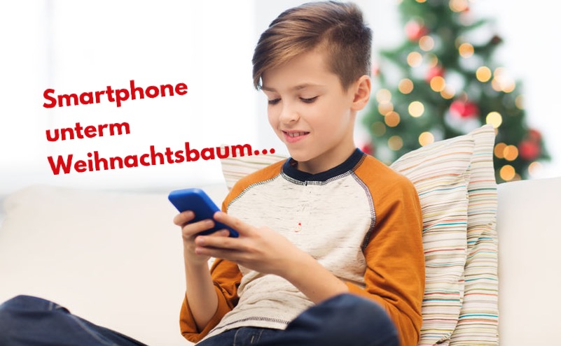 Smartphone unterm Weihnachtsbaum
